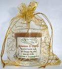 The three wise men Gold organza gift bag,
with a Cinnamon and Orange candle in a glass.